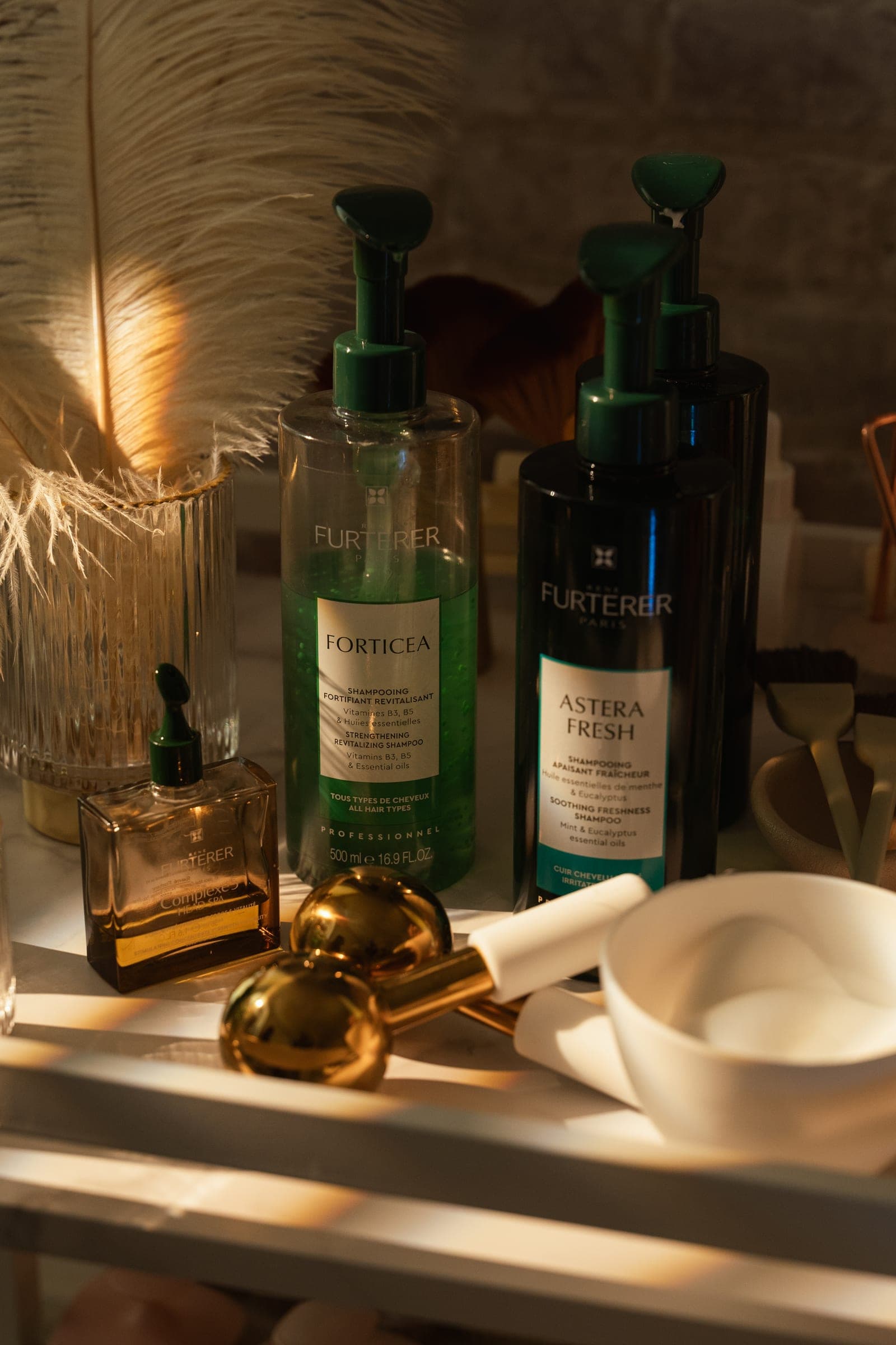 René Furterer scalp and hair products with brass tools on the retail shelf.